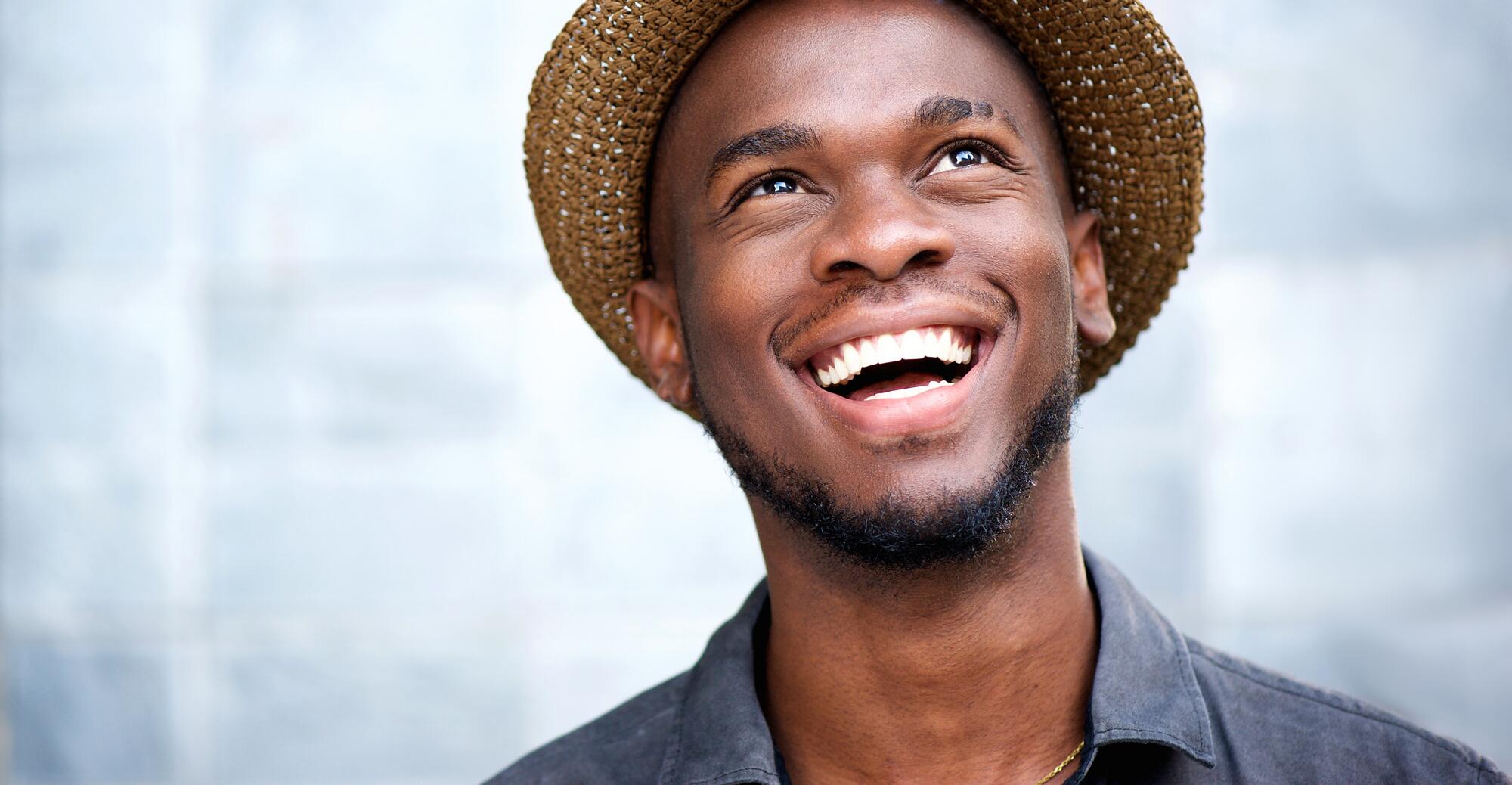 OC_YOUNG_MAN_HAT_SMILE_SHUTTERSTOCK_253202191