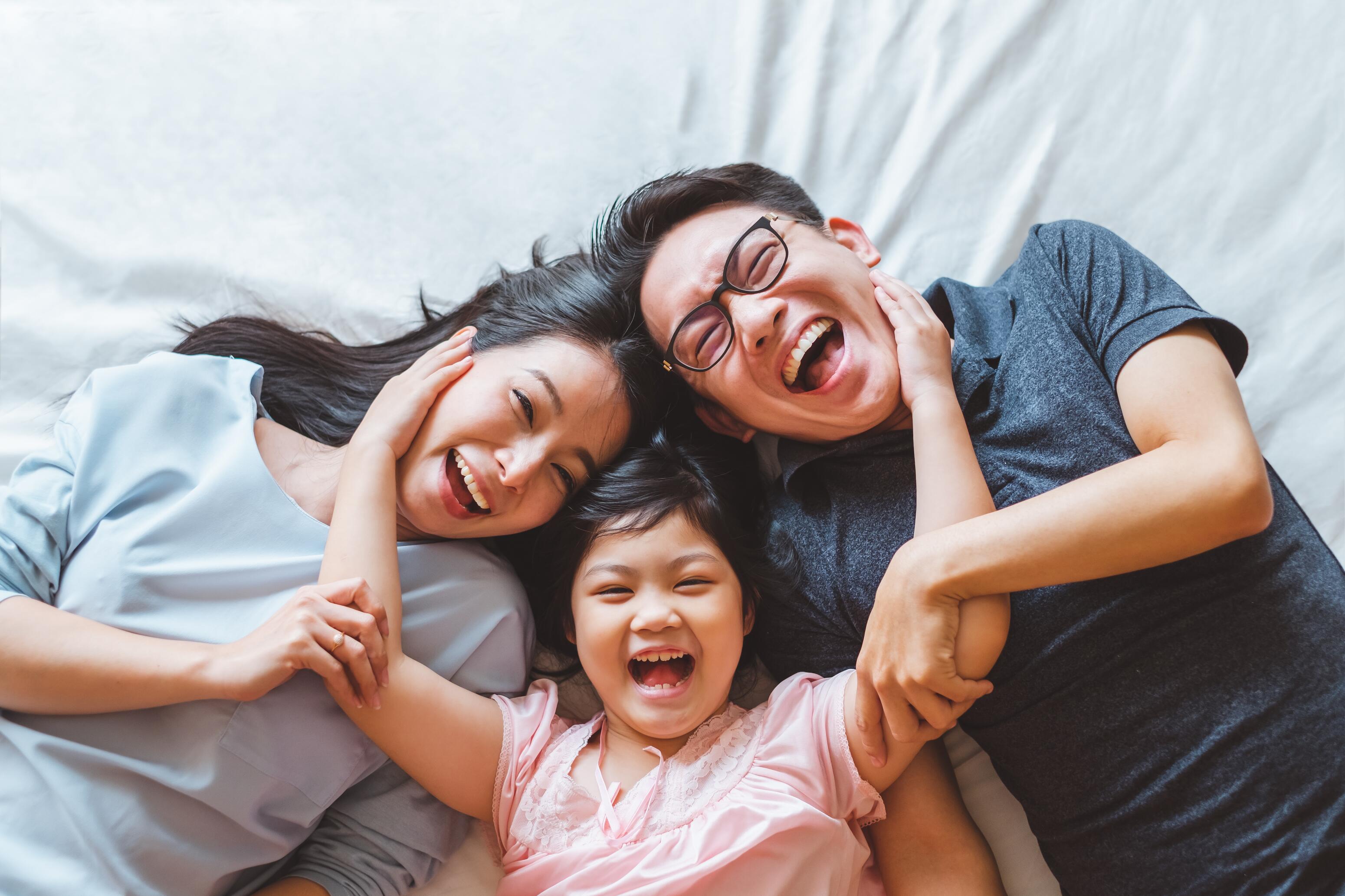 OC_FAMILY_ASIAN_SMILE_HAPPY_SHUTTERSTOCK_1372046480