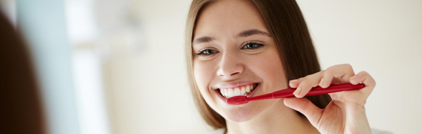 oc_young woman_smile_teeth brushing_shutterstock_416232895