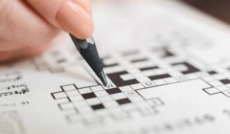 OG_ELDERLY_WOMAN_COMPLETING_THE_CROSSWORD_AT_HOME_ISTOCK_2023