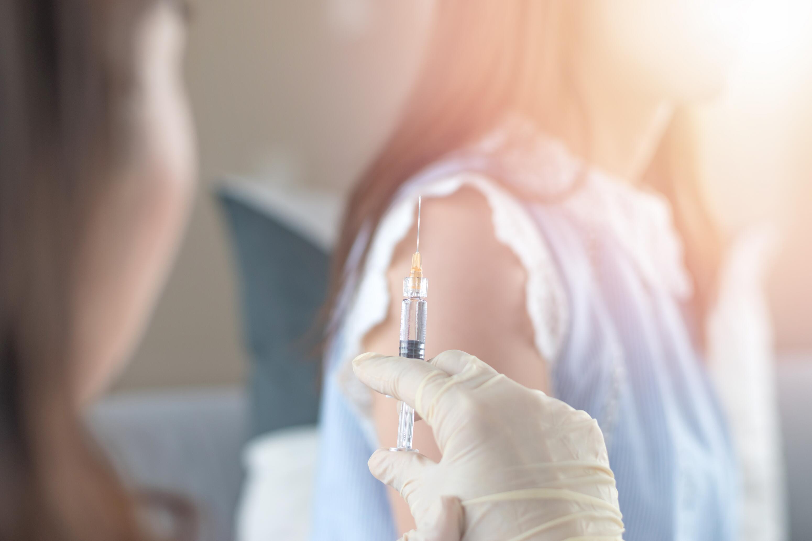 OG_VACCINATION_OF_A_WOMAN_WITH_A_SYRINGE_BY_THE_NURSE_OR_PUBLIC_HEALTH_NURSE_ISTOCK_2023