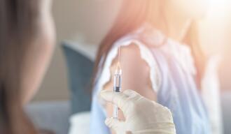 OG_VACCINATION_OF_A_WOMAN_WITH_A_SYRINGE_BY_THE_NURSE_OR_PUBLIC_HEALTH_NURSE_ISTOCK_2023