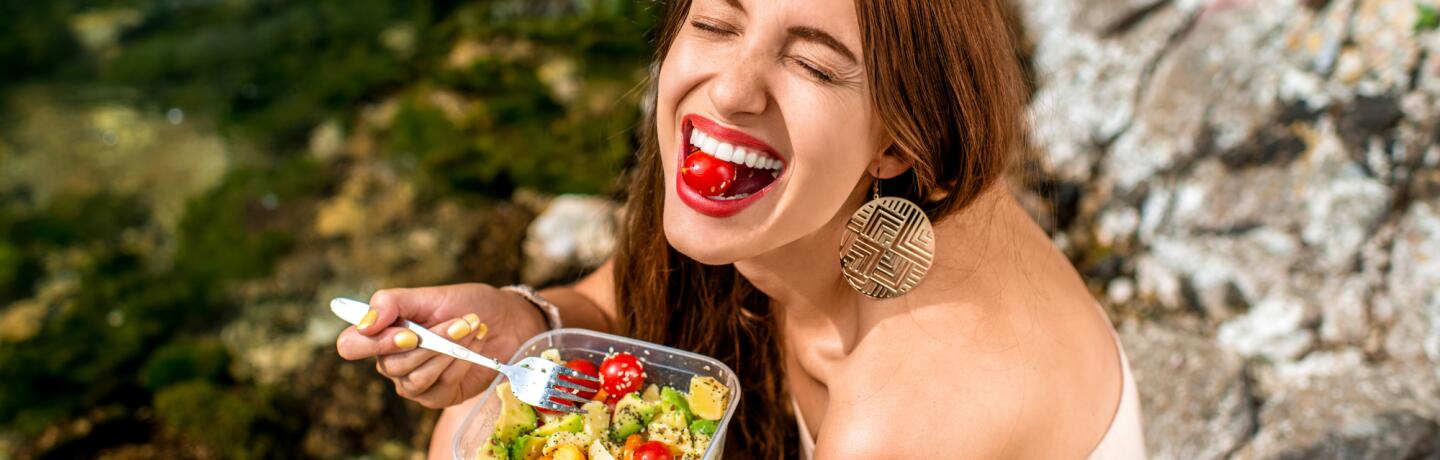 OC_YOUNG_GIRL_EATING_SMILING_HEALTHY_SHUTTERSTOCK_291921743