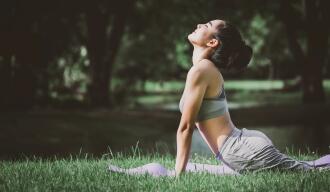 OG_FIT_ASIAN_WOMAN_DOING_YOGA_IN_THE_PARK_ISTOCK_2023
