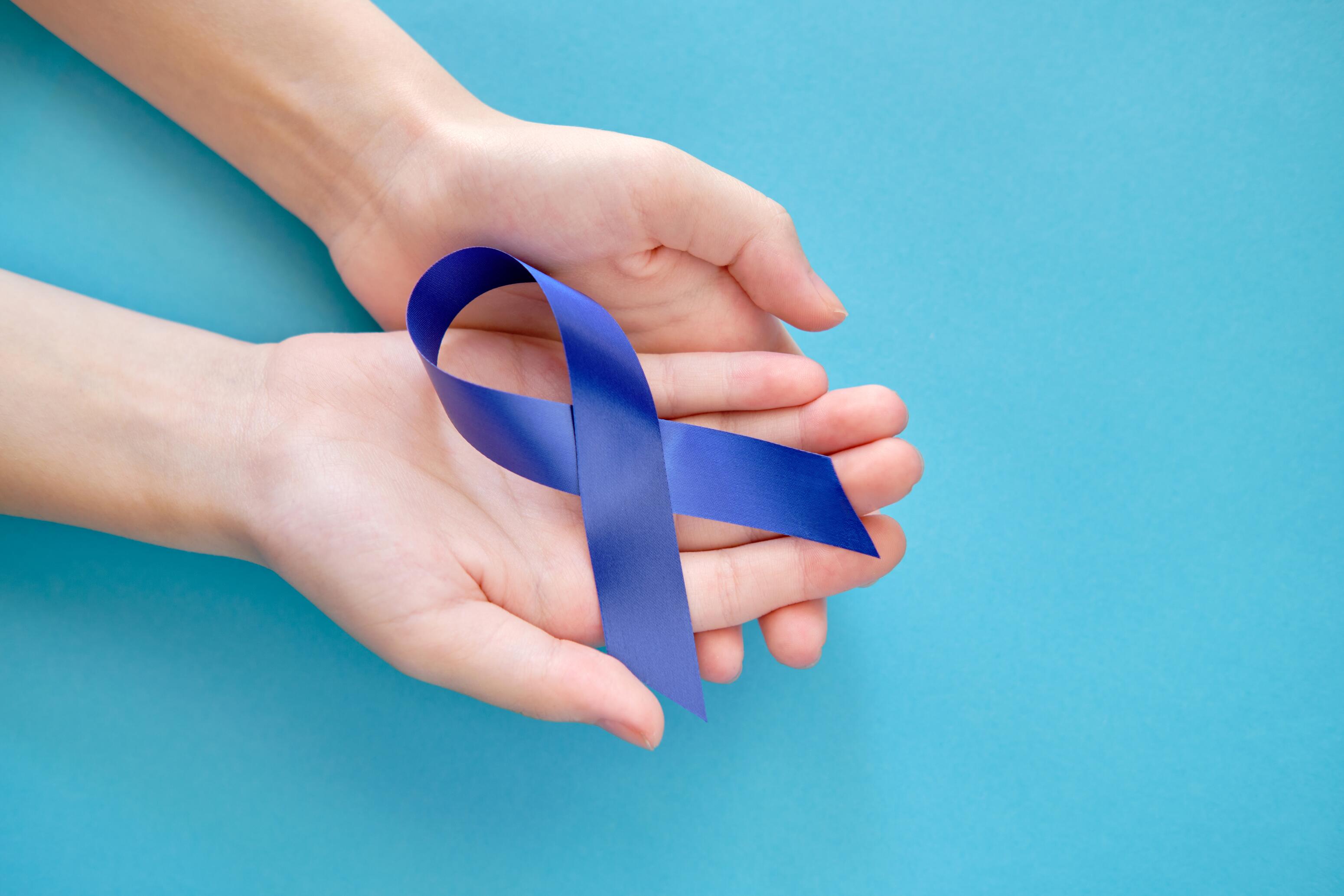 OG_HANDS_HOLDING_BLUE_RIBBON_CANCER