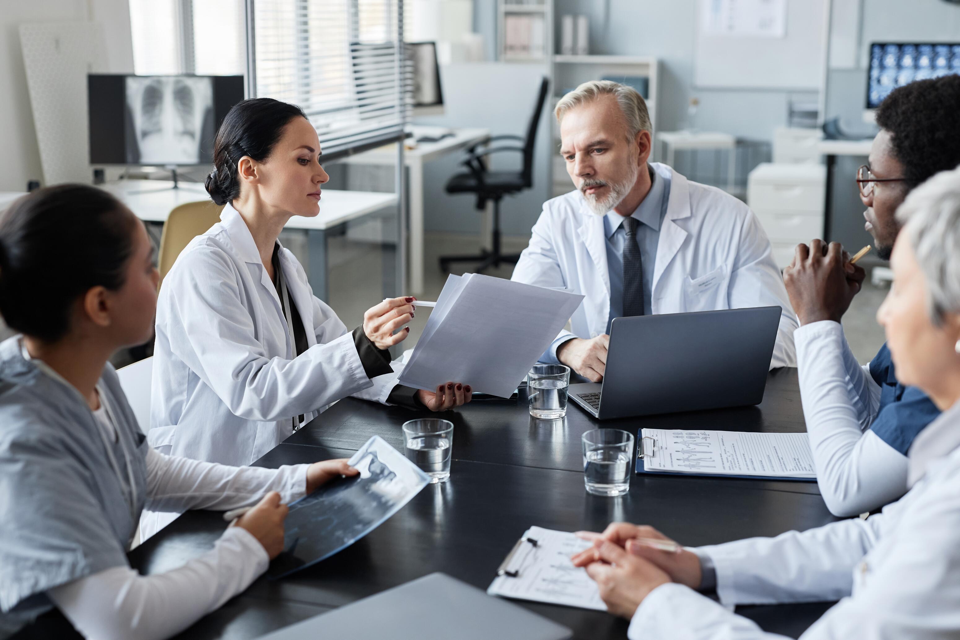 Dermatologist looking at photos of eczema on his computer