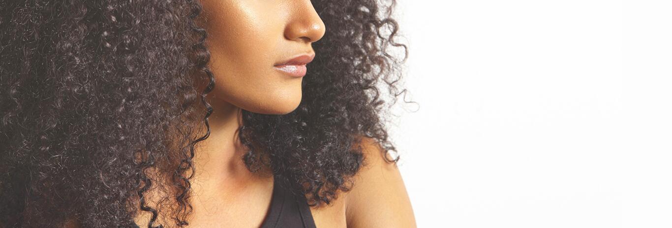 Hydrate and nourish curly or frizzy hair daily